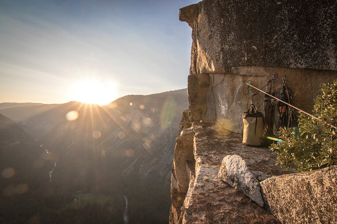 Camp at Dano Ledge at sunset, high up on West Face of Leaning Tower above Yosemite Valley, Yosemite National Park, California, USA