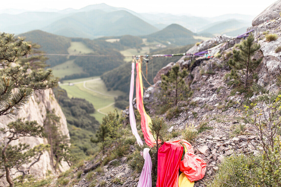 Silks used by aerial silk performers hanging from highline between cliffs, Lower Austria, Austria