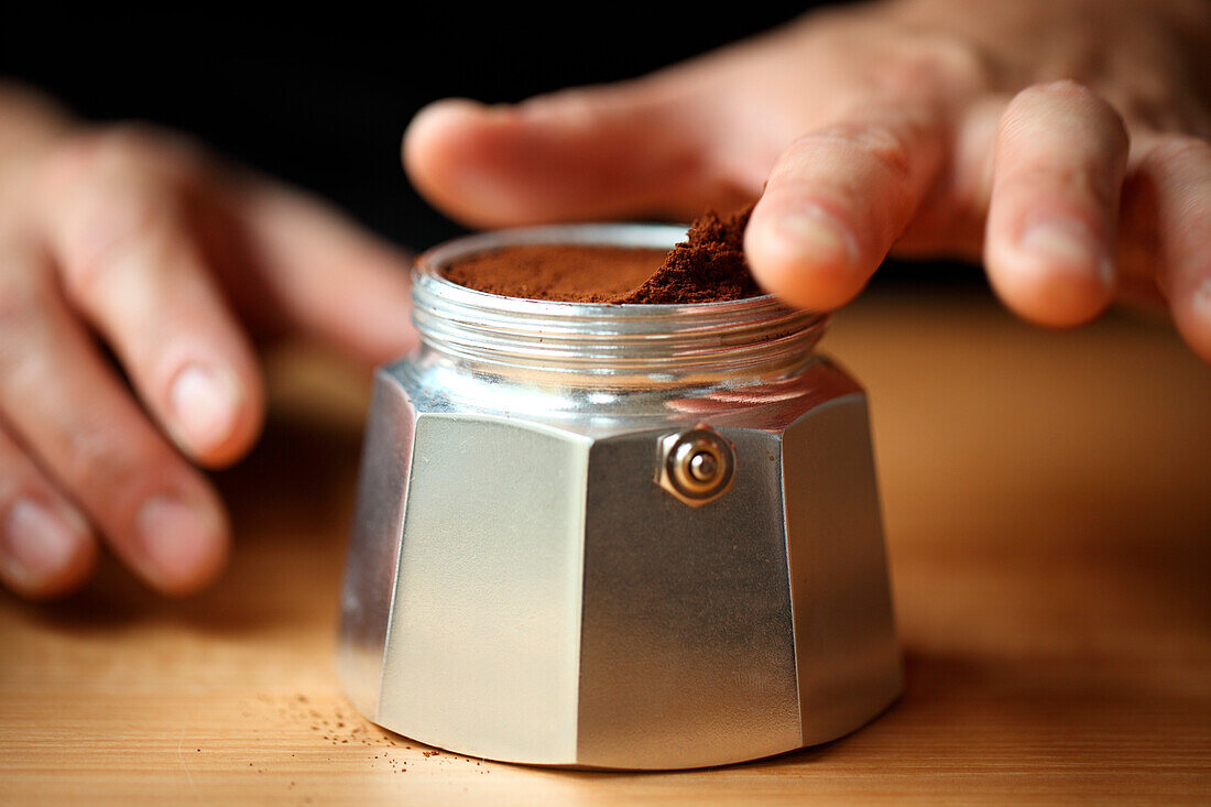 Close up of ground coffee in silver container, Oakland, USA