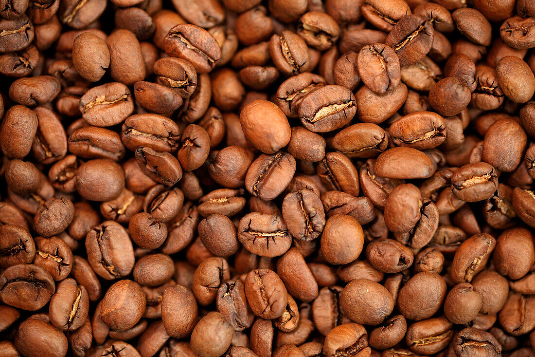 Full frame of brown roasted coffee beans, Oakland, California, USA