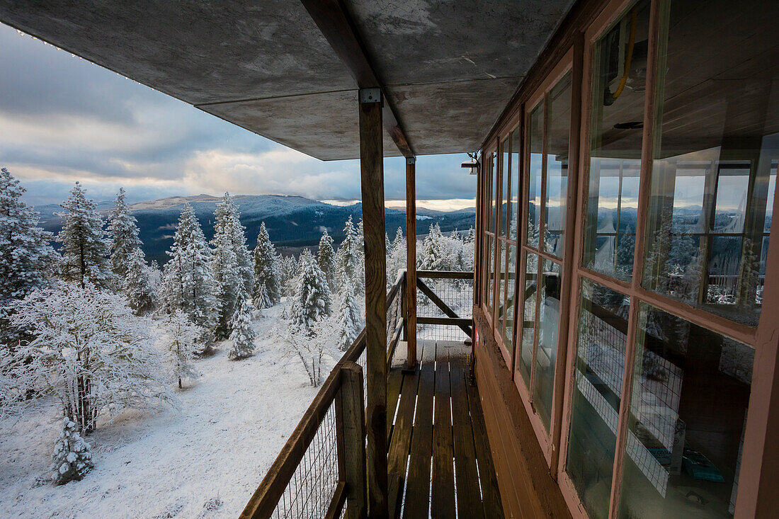 Snowy winter landscape of forest with mountains view from top of Pickett Butte Fire Lookout near Tiller, Oregon, USA