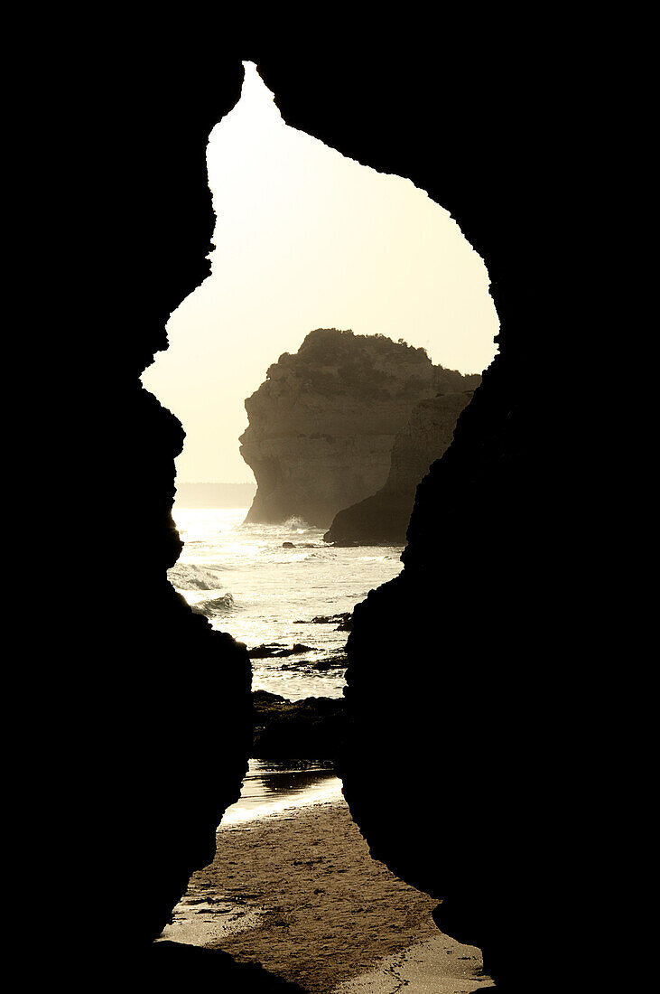 View of beach from cave, Praia dos Tres Irmaos, Alvor, Algarve, Portugal