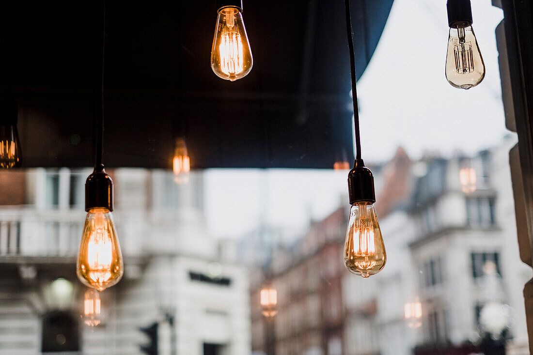 Light bulbs in bar, London, England, UK