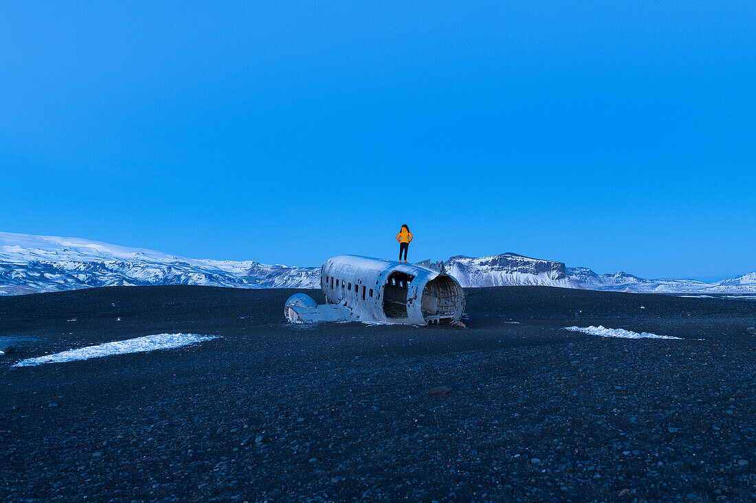 on the planewreck of a C117 that crash landed in the Sólheimasandur, southcoast, Iceland
