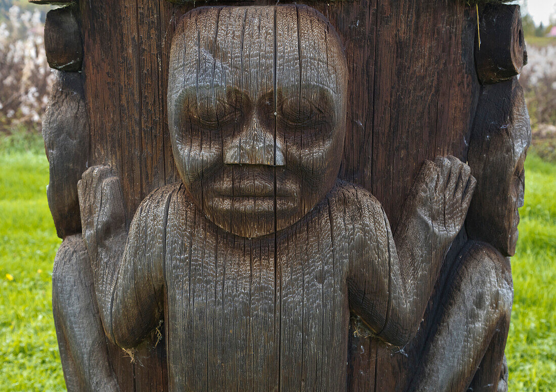 Wooden totem pole showing child, Kispiox, British Columbia, Canada