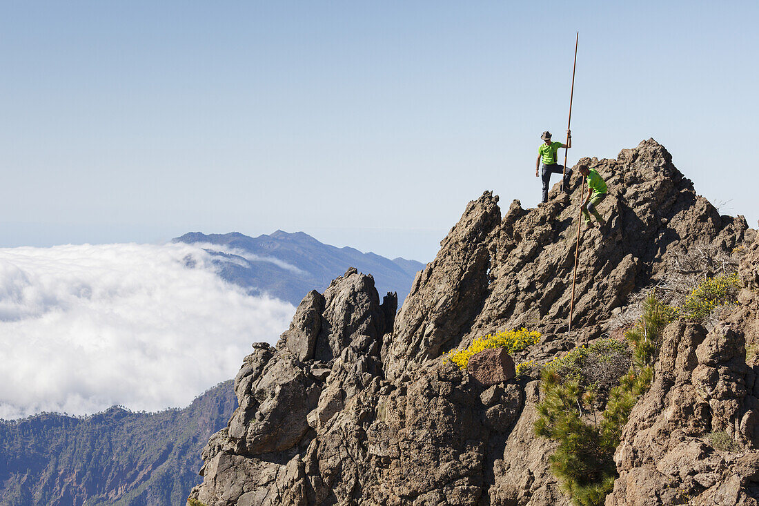 men jumping with the canarian crook, Salto del Pastor Canario, crater rim, Caldera de Taburiente, UNESCO Biosphere Reserve, La Palma, Canary Islands, Spain, Europe