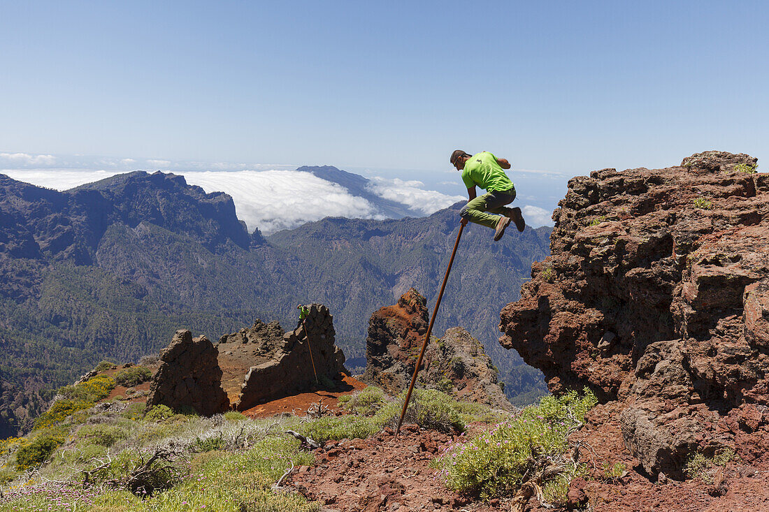 man jumping with the canarian crook, Salto del Pastor Canario, crater rim, Caldera de Taburiente, UNESCO Biosphere Reserve, La Palma, Canary Islands, Spain, Europe