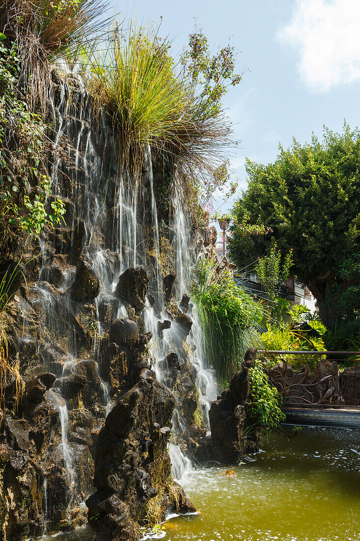 artificial waterfall, El Jardin de las Delicias, Parque Botanico, town parc, designed by the artist Luis Morera, Los Llanos de Aridane, UNESCO Biosphere Reserve, La Palma, Canary Islands, Spain, Europe