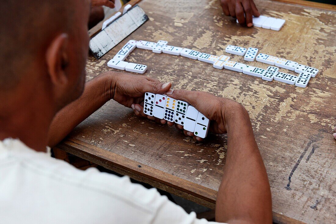Men playing dominos in a street of Remedios, Cuba.