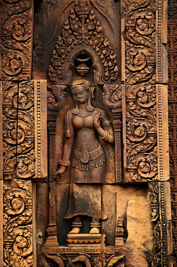 Devata carving, Banteay Srei temple, Angkor, Cambodia. The citadel of women, this temple contains the finest, most intricate carvings to be found in Angkor. 967 CE.