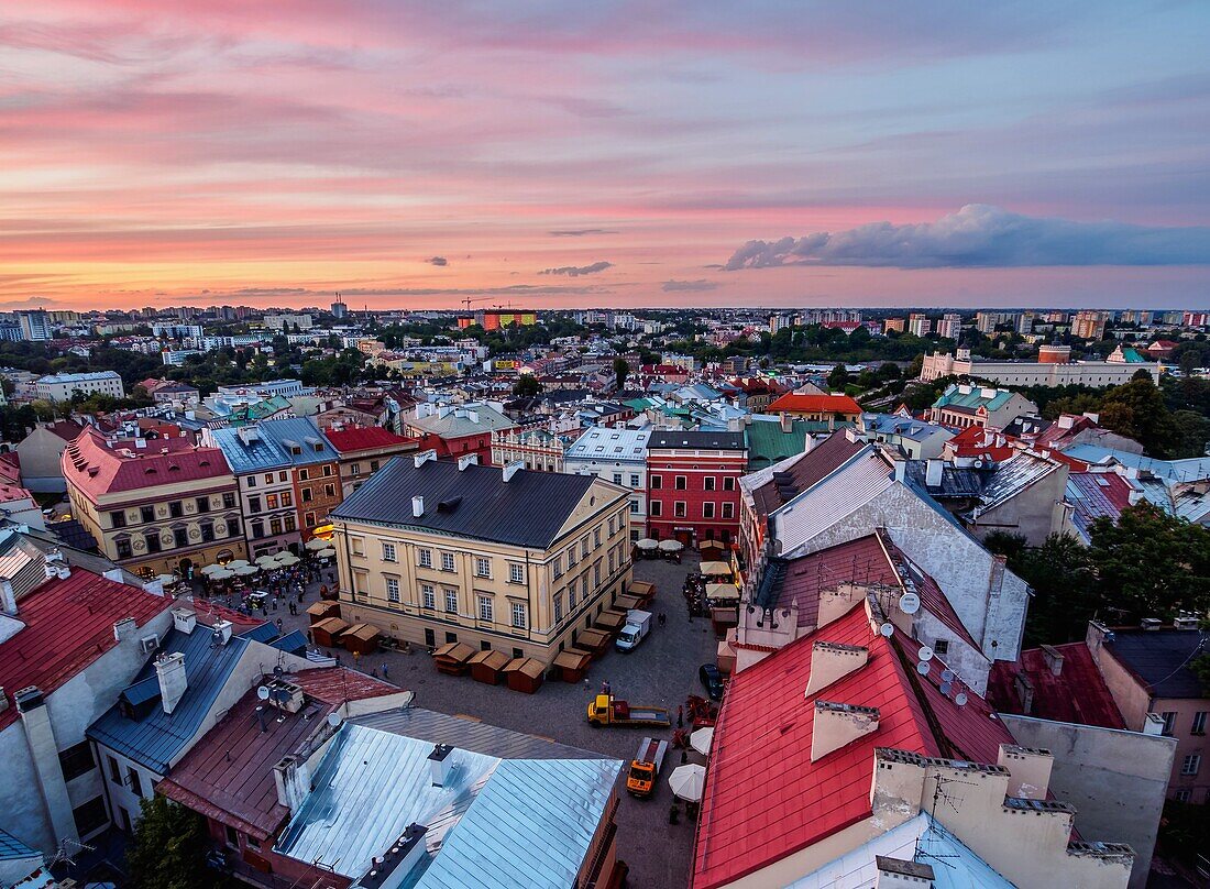 Poland, Lublin Voivodeship, City of Lublin, Old Town, Elevated view of the Market Square at sunset.