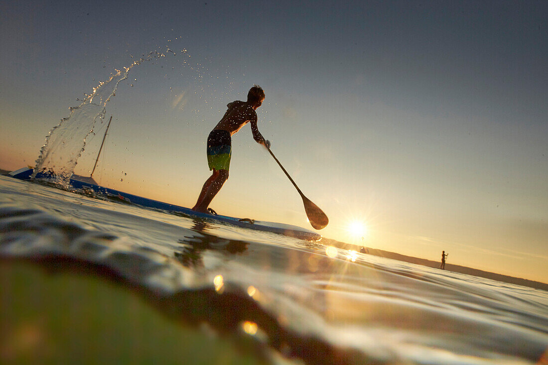 Stand Up Paddler on Lake Starnberg,  Young Boy SUP, Lake Starnberg, Bavaria, Germany