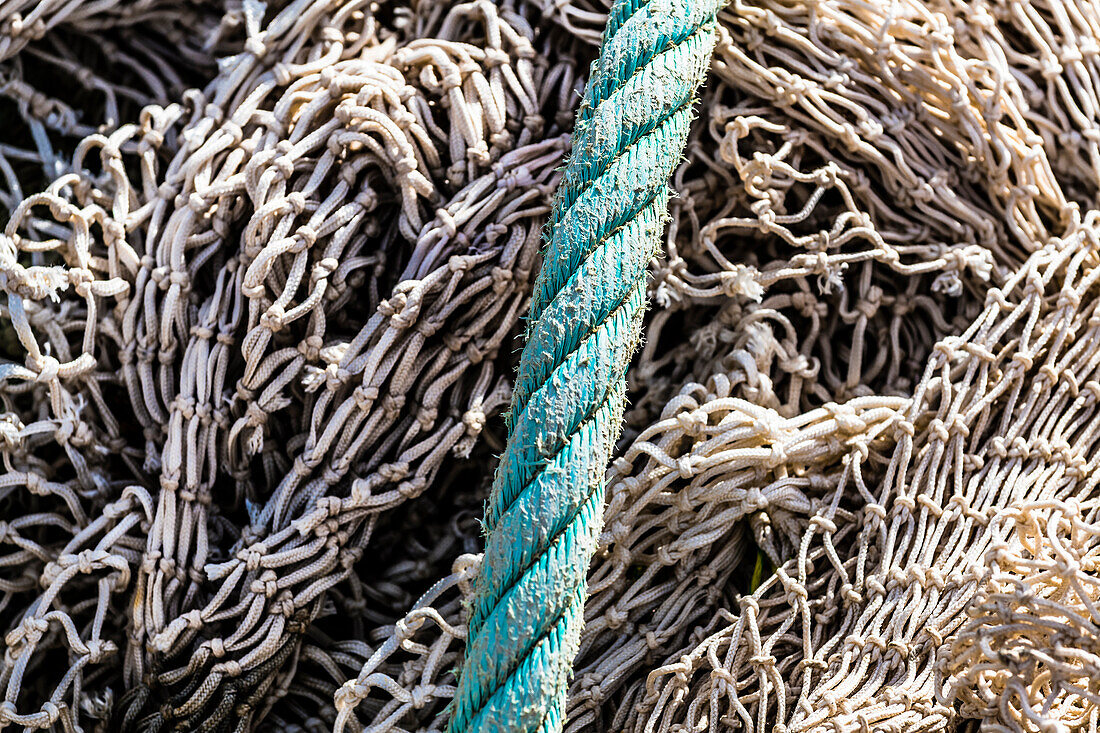 Fishing nets and a thick rope in the harbour, Port de Sóller, Mallorca, Spain