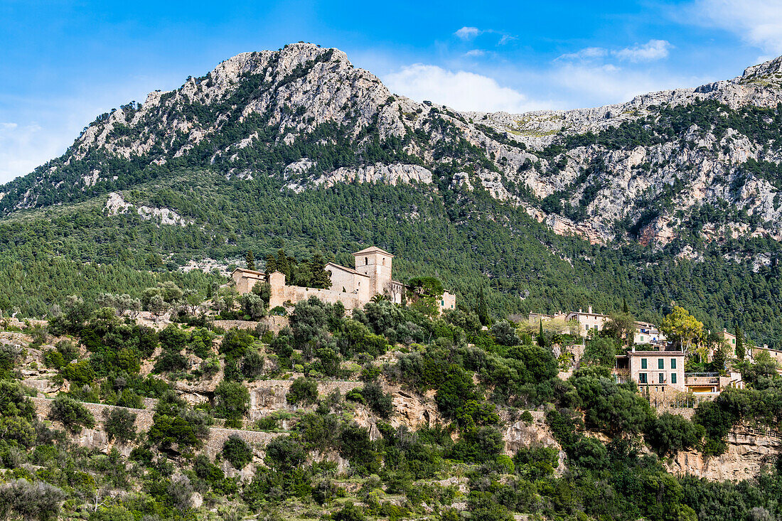 View at the village with church Parroquia San Juan Bautista, Deià, Tramuntana Mountains, Mallorca, Spain