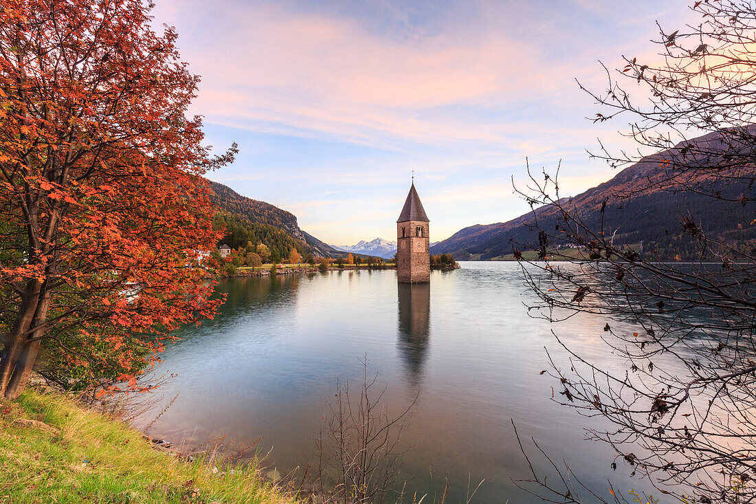 Bell tower of semi submerged church in Lake Resia (Reschensee), Curon Venosta, province of Bolzano, South Tyrol, Italy
