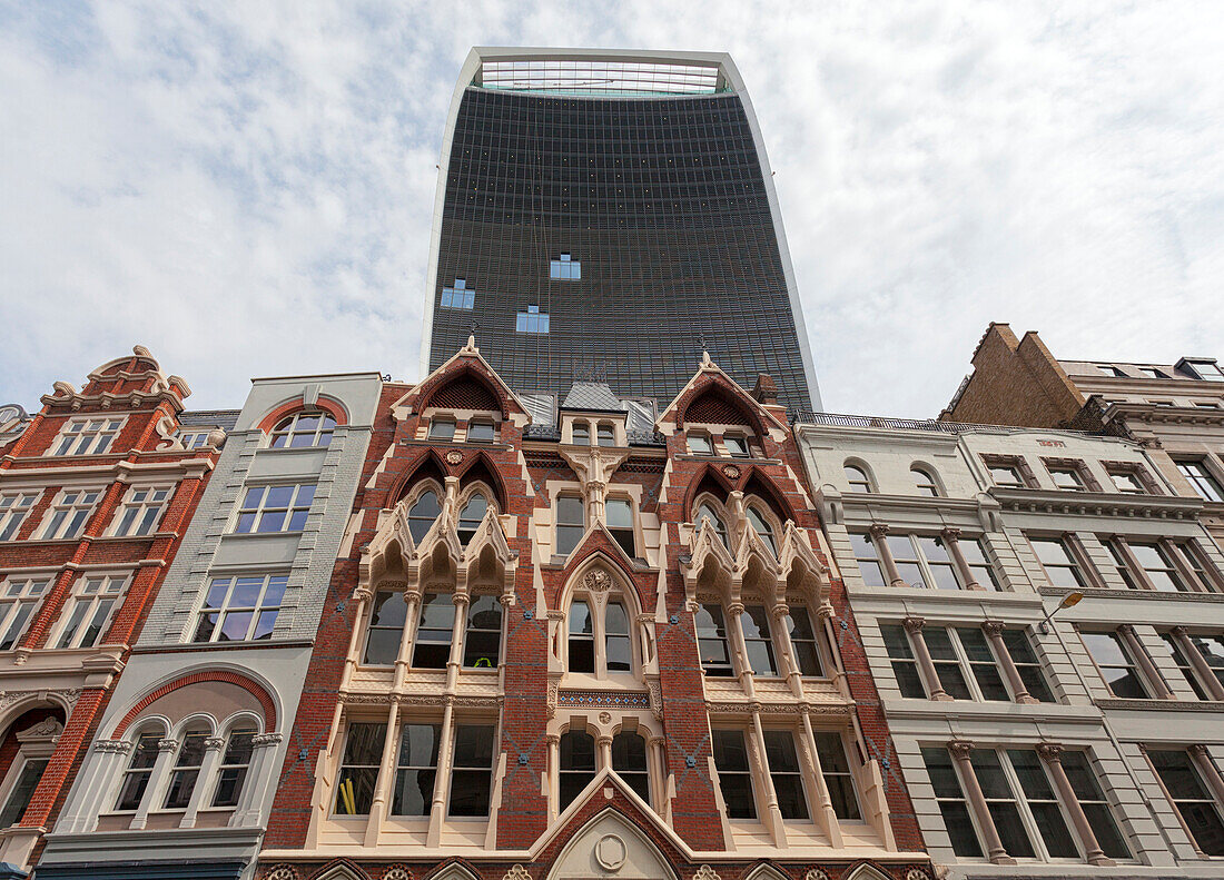 The skyscraper at 20 Fenchurch Street overhangs an victorian building in City of London, London, Great Britain, UK