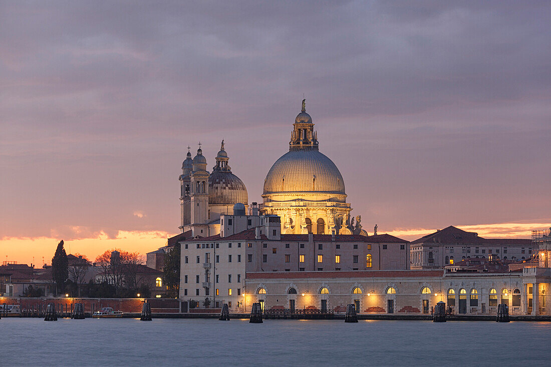 View of church of Santa Maria della Salute from San Giorgio Maggiore island at dusk, Venice, Veneto, Italy