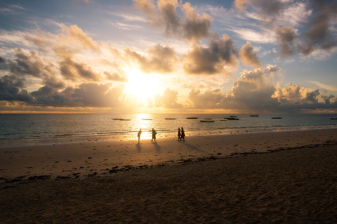 East Africa, Tanzania, Zanzibar, sunrise on Kiwengwa beach with a masai group.