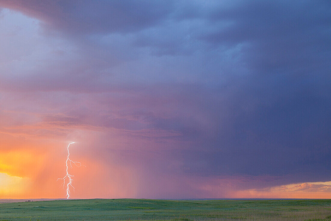 Lightning strike over prairie, Badlands National Park, South Dakota