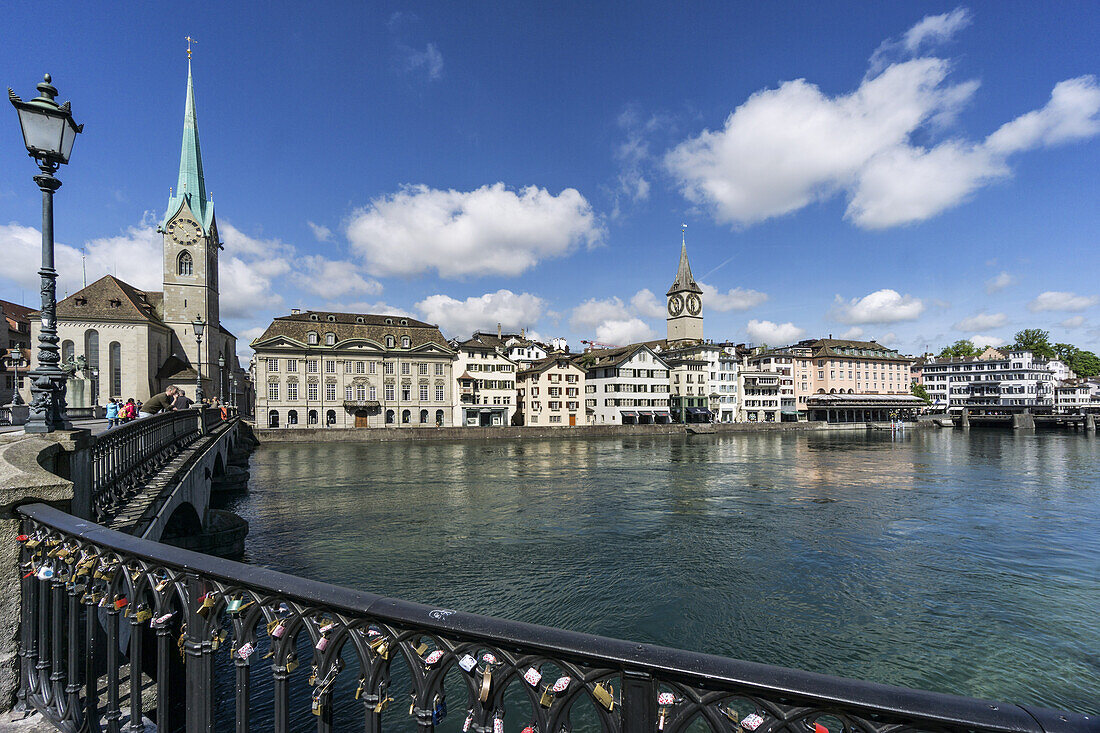 Munster bridge, river Limmat, Fraumunster, St. Peters church, cityscape Zurich, switzerland
