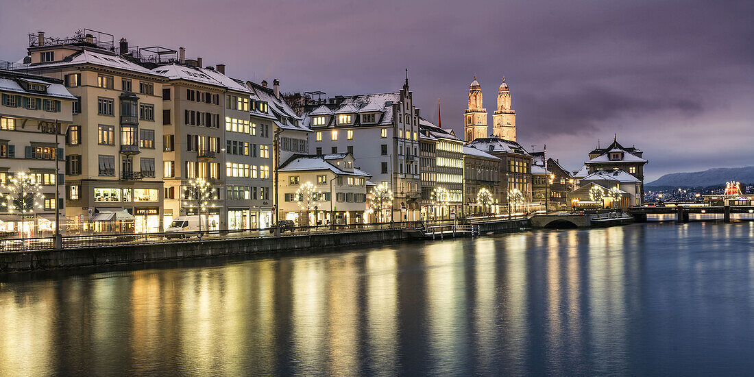 Christmas illumination Limmatquai, Grossmunster cathedral, winter, snow, Zurich, Switzerland