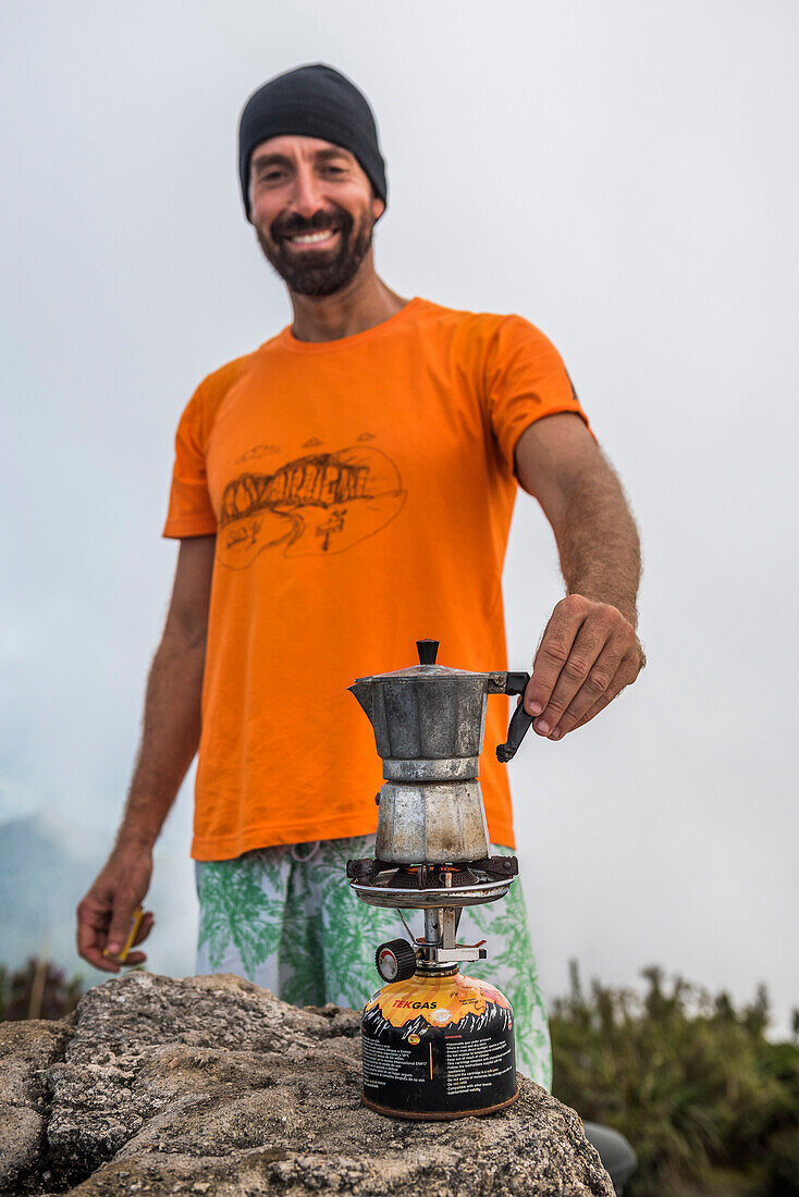 Having a coffee on top of Pico da Caledonia in Tr??s Picos State Park, Rio de Janeiro, Brazil