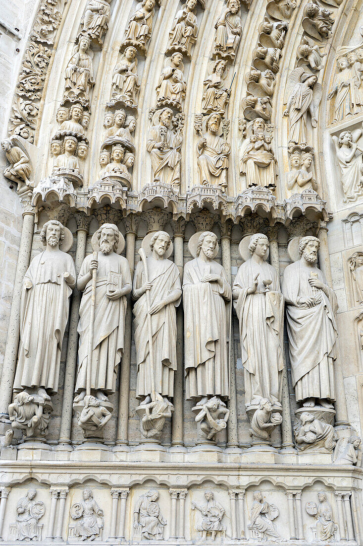 Stone Statues Carved on the facade of Notre Dame Cathedral, Paris, France