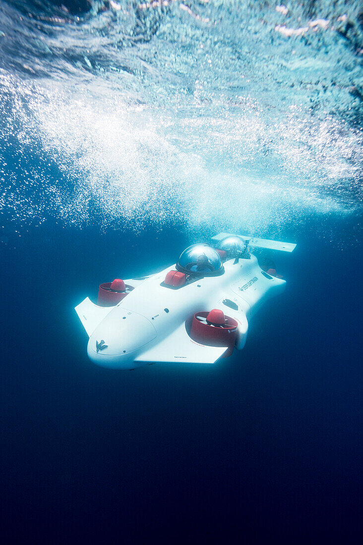 Photograph with prototype two-man personal submarine traveling underwater, Lake Tahoe, California, USA