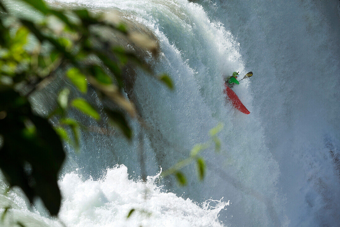 A profesional kayaker runs the amazing waterfalls during the Rey del R??o competition in Agua Azul in Chiapas, M??xico