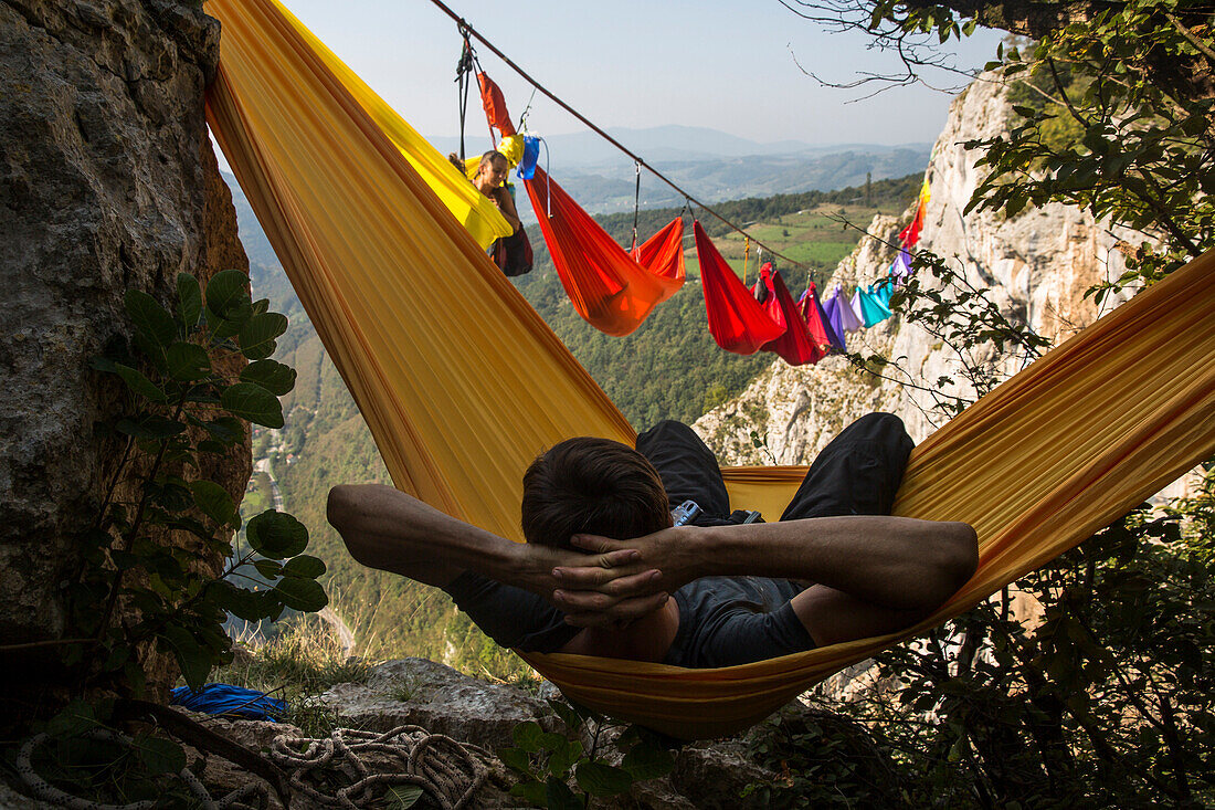 Rear view of man lying in hammock, Tijesno Canyon, Banja Luka, Bosnia and Herzegovina