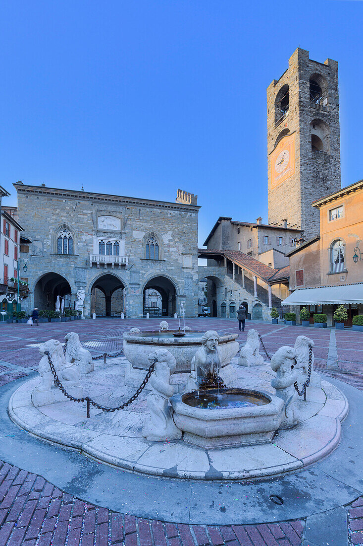 Piazza Vecchia with civic tower and Fontana del Contarini. Bergamo(Upper Town), Lombardy, Italy.