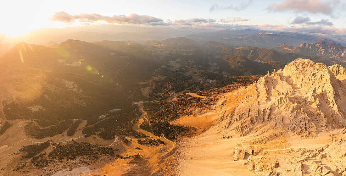 Panoramic aerial view of Latemar massif and Obereggen at sunset, Dolomites, South Tyrol, Italy