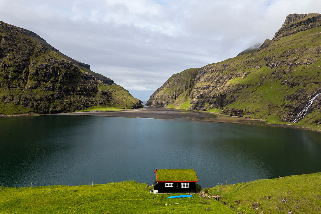 Grass roof house on sea shore, Saksun, Streymoy Island, Faroe Islands