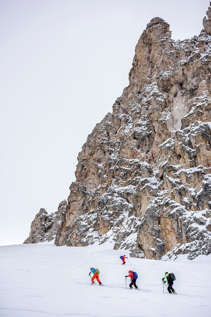 Several persons backcountry skiing ascending to Forcella Roa, Forcella Roa, Natural Park Puez-Geisler, UNESCO world heritage site Dolomites, Dolomites, South Tyrol, Italy