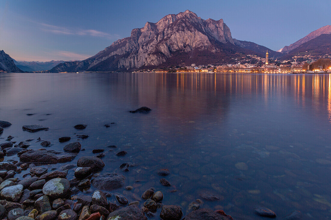 View of Lake Como surrounding the city of Lecco during dusk,Lombardy,Italy