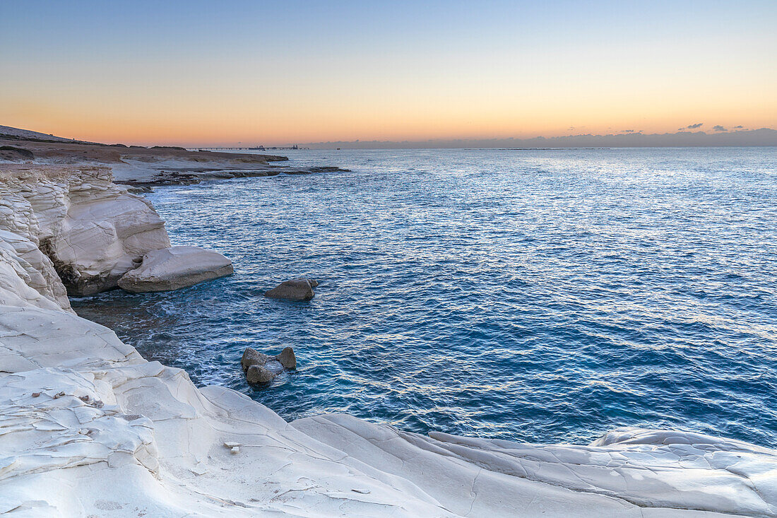 Cyprus, Limassol, The crystal water and the white rocks of Governor’s Beach at dawn