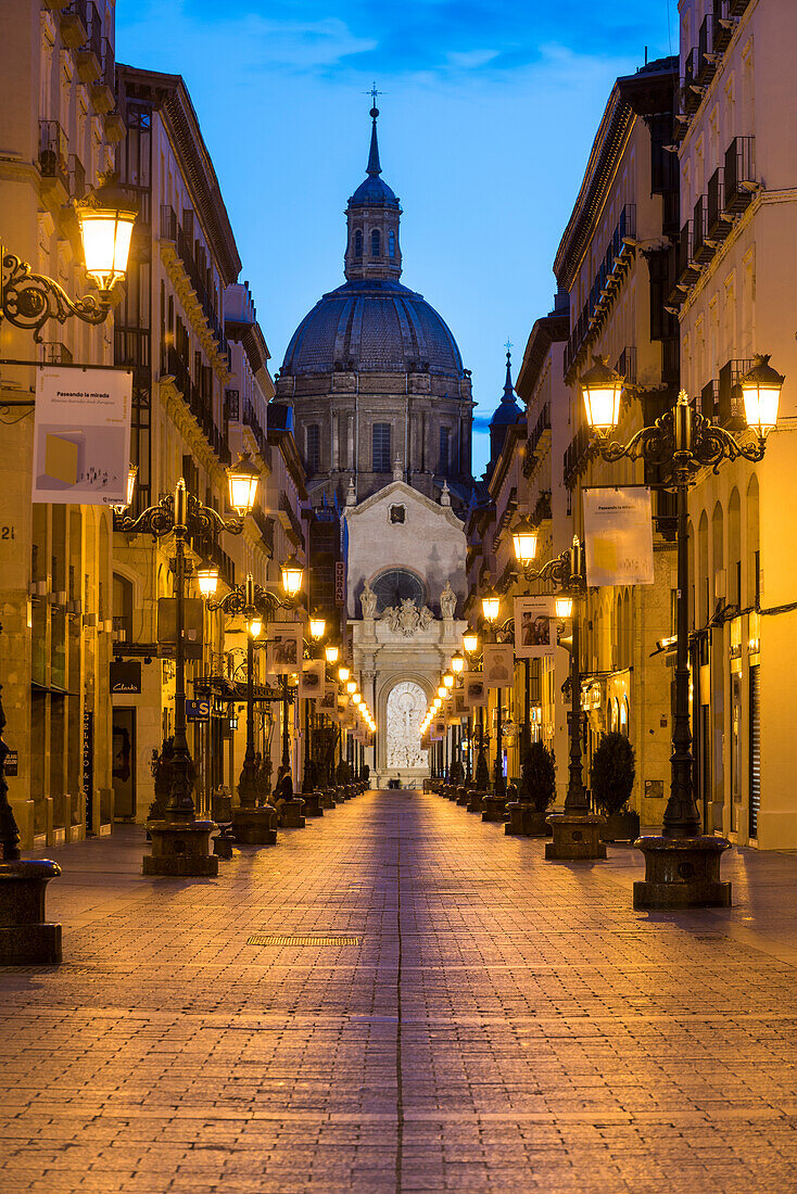 Calle Alfonso and the Cathedral of Our Lady of the Pillar at dusk. Zaragoza, Aragon, Spain, Europe