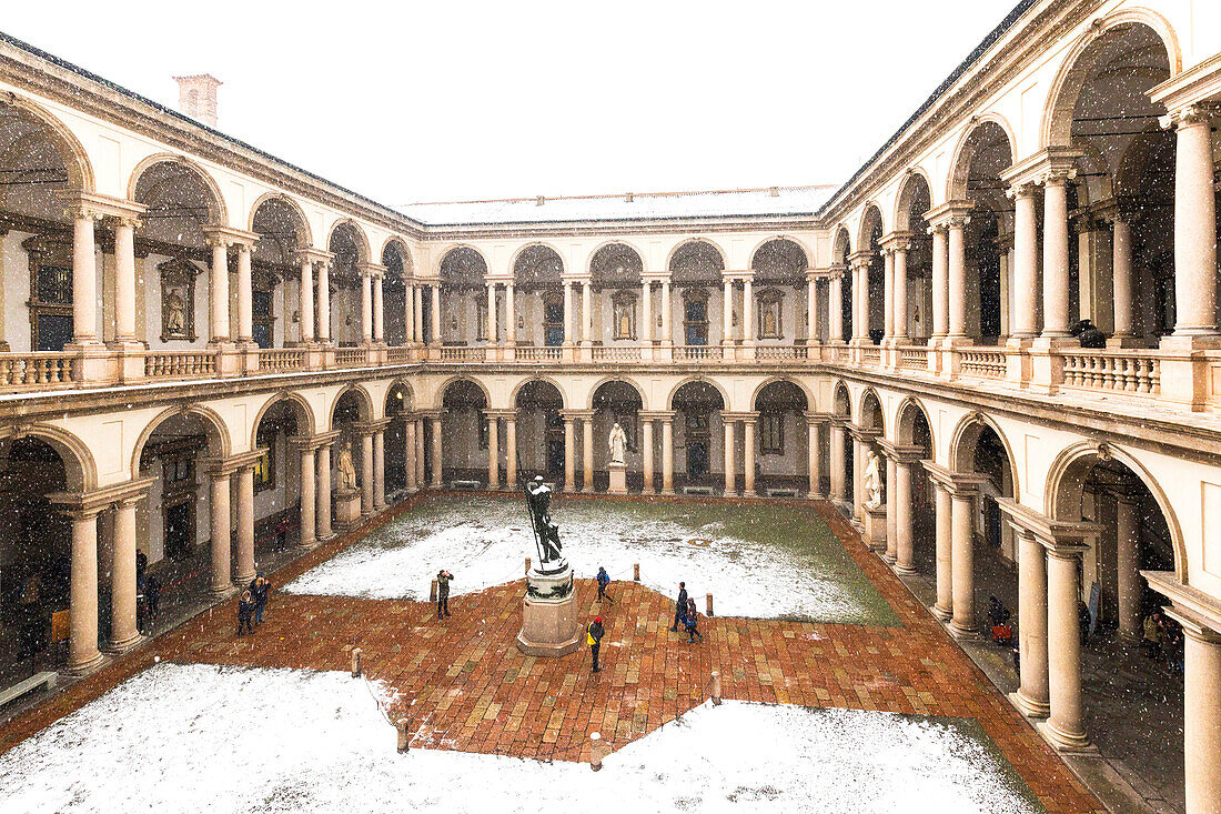 Courtyard of honor of the Palace of Brera during snowfall. Milan, Lombardy, Northern Italy, Italy.