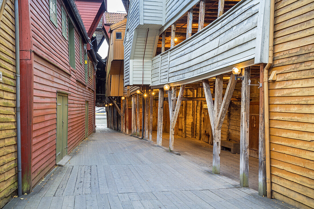 Historic narrow street between wooden houses in hanseatic quater, old town of Bergen, Hordaland, Southern norway, Norway, Scandinavia, Northern Europe, Europe