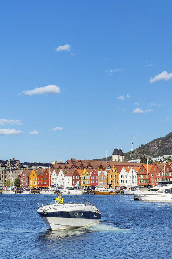 Boat in front of hanseatic quater Bryggen, old town of Bergen, Hordaland, Southern norway, Norway, Scandinavia, Northern Europe, Europe