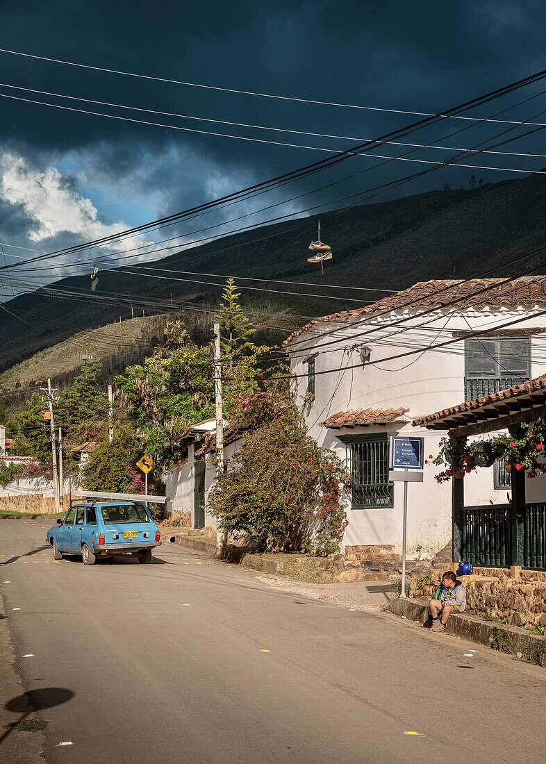 old car and shoes hanging in power lines, Villa de Leyva, Departamento Boyacá, Colombia, South America