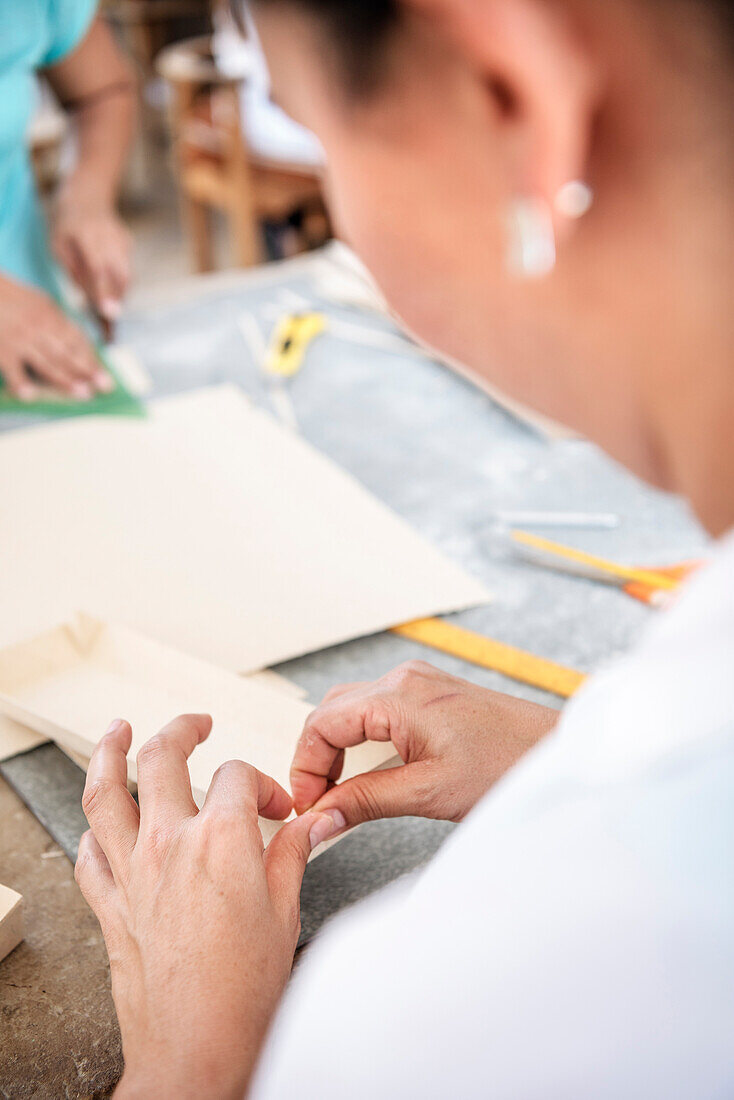 workers producing diverse things with their fine art paper, historical Paper Production at Fundación San Lorenzo, Barichara, Departmento Santander, Colombia, Southamerica