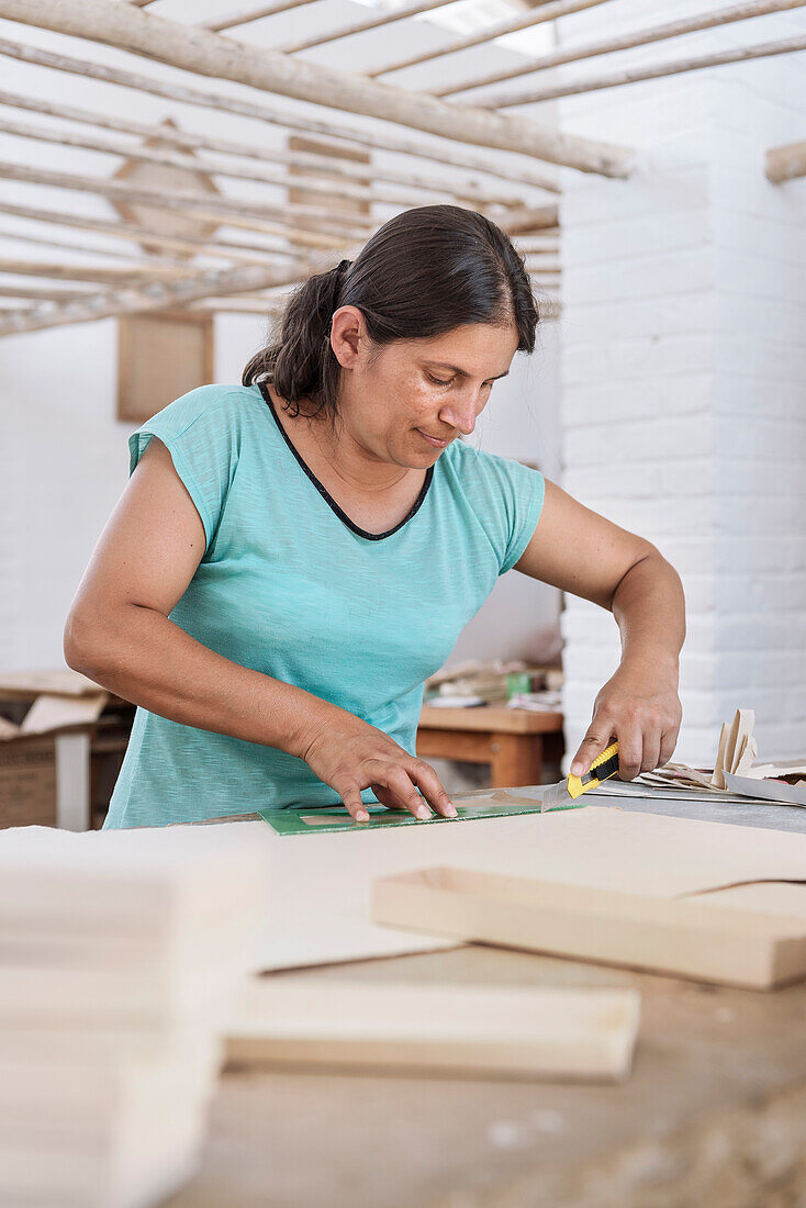 workers producing diverse things with their fine art paper, historical Paper Production at Fundación San Lorenzo, Barichara, Departmento Santander, Colombia, Southamerica