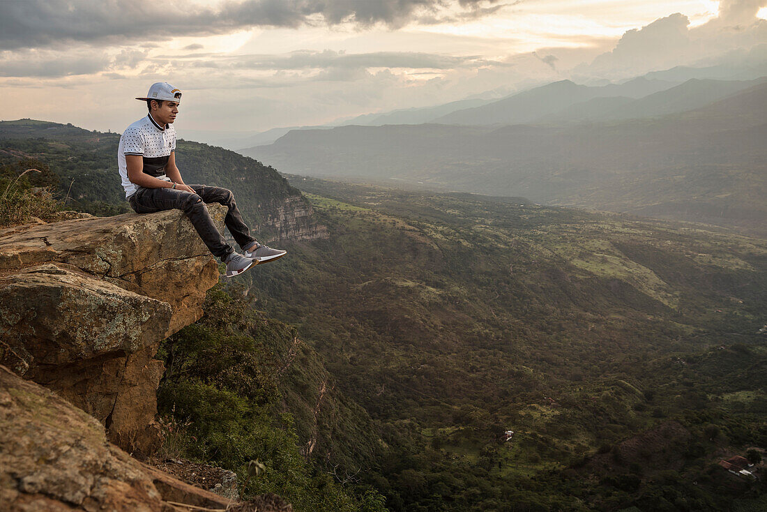 young Colombian enjoying the view at the spectacular surrounding landscape of Barichara, Departmento Santander, Colombia, Southamerica