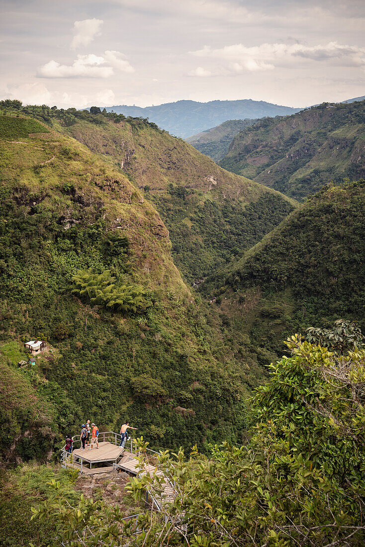 juvenile colombiuan travellers rest at viewing platform at Magdalena river gorge, archaeological excavation site La Chaquira, San Agustin, archaeological park, UNESCO Weltkulturerbe, Departmento Huila, Colombia, Southamerica