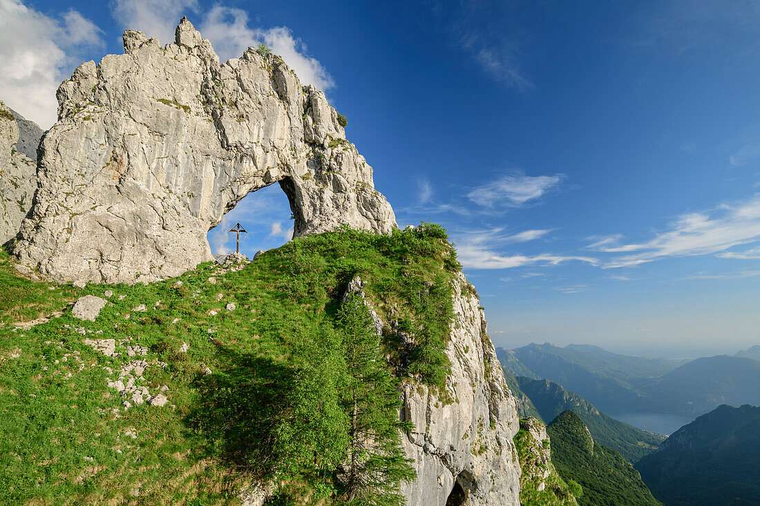 Rock arch with crucifix, Grigna, Bergamasque Alps, Lombardy, Italy