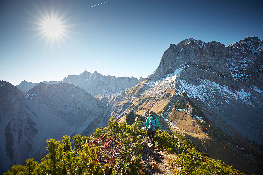 Two women descending Hahnkampl, Lamsenspitze in the back,  Eastern Karwendel Range, Tyrol, Austria