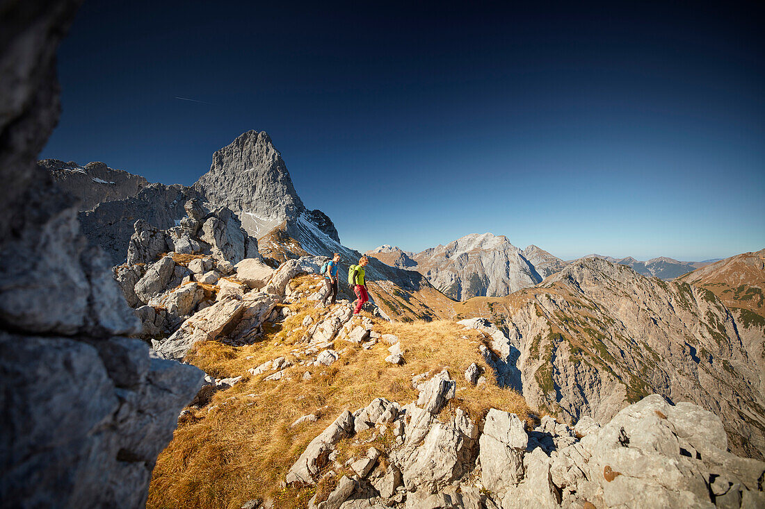 two women on the ridge of Schafjoechl, Lamsenspitze in the back,  Eastern Karwendel Range, Tyrol, Austria