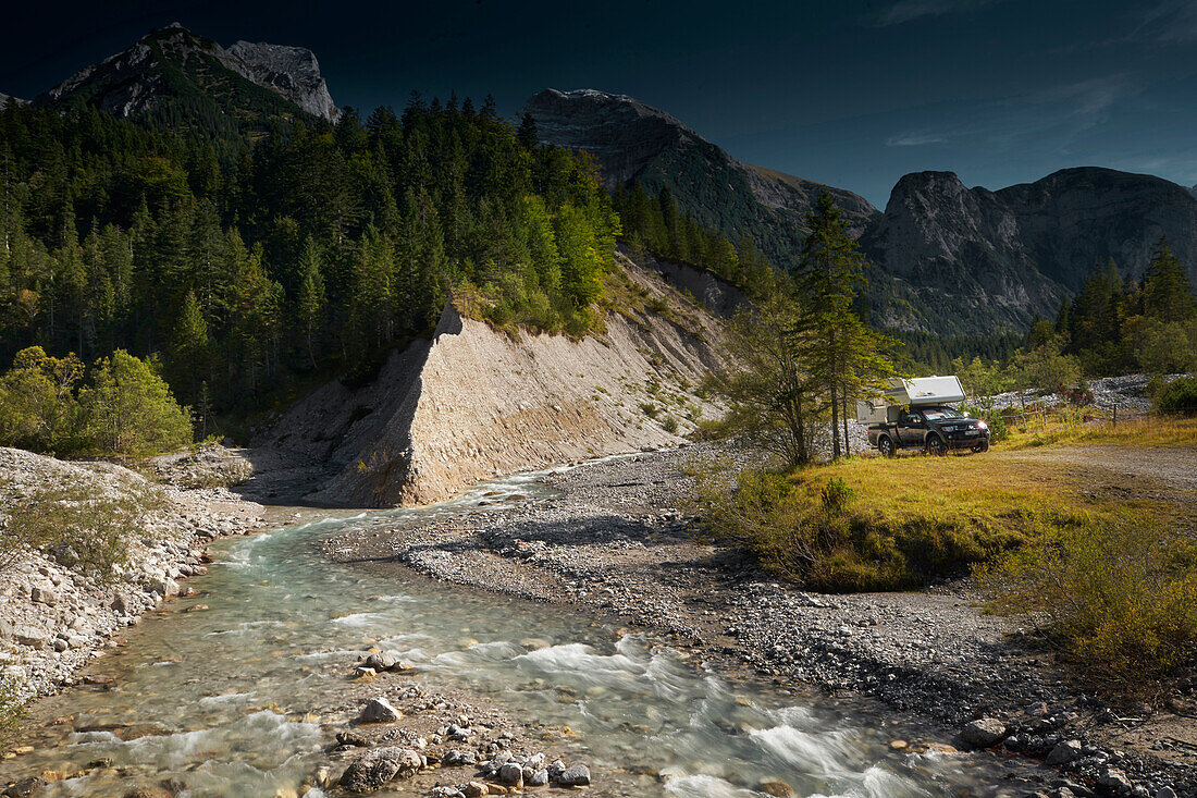 campervon on the banks of river Riss ,  Karwendel mountains, Tyrol, Austria