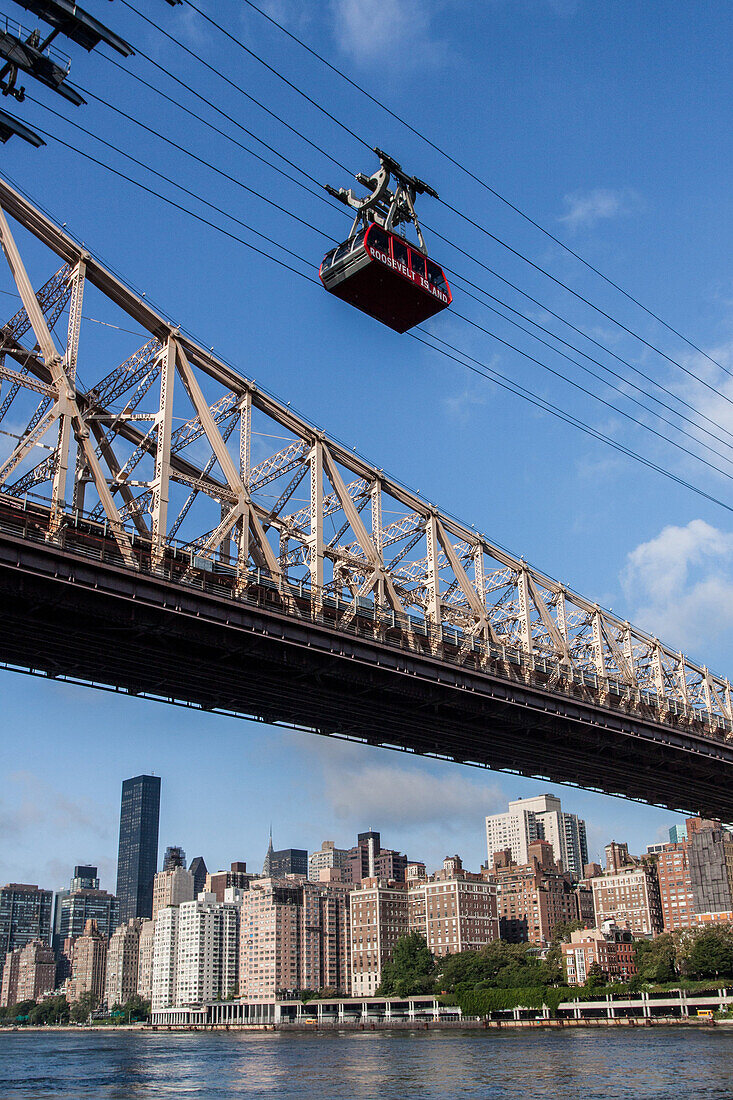 cabin of the roosevelt island aerial tramway over the east river and the queensboro bridge, cable car built by the french company poma, manhattan, new york city, new york, united states, usa